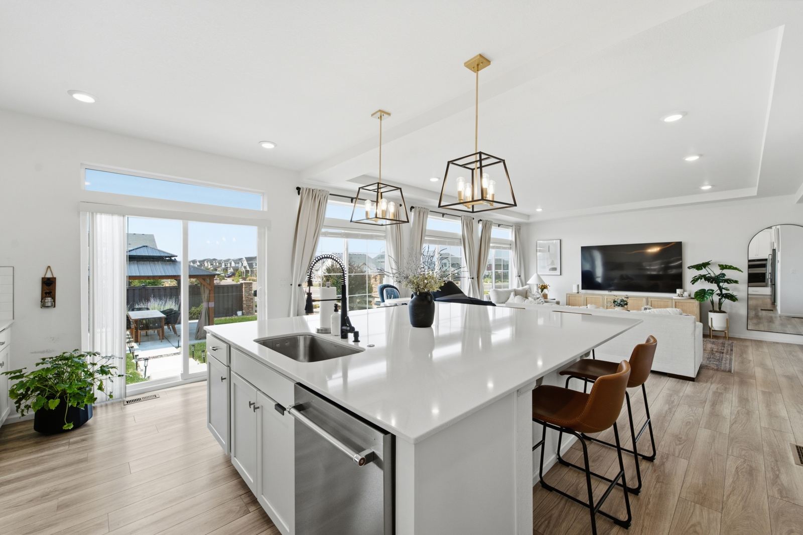 Open-concept kitchen with white island, Denver listing photo