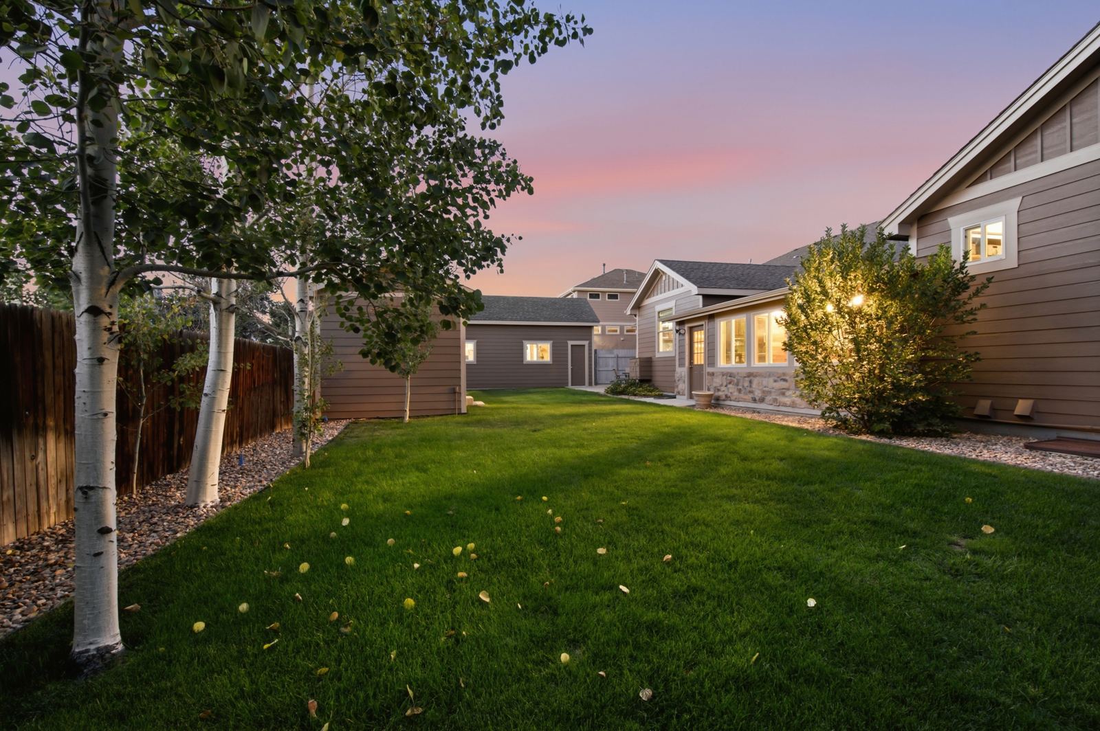 Twilight backyard real estate photo with aspen trees in Colorado